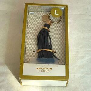 Black leather fringe keychain with gold coin “L” letter initial (NWT)
